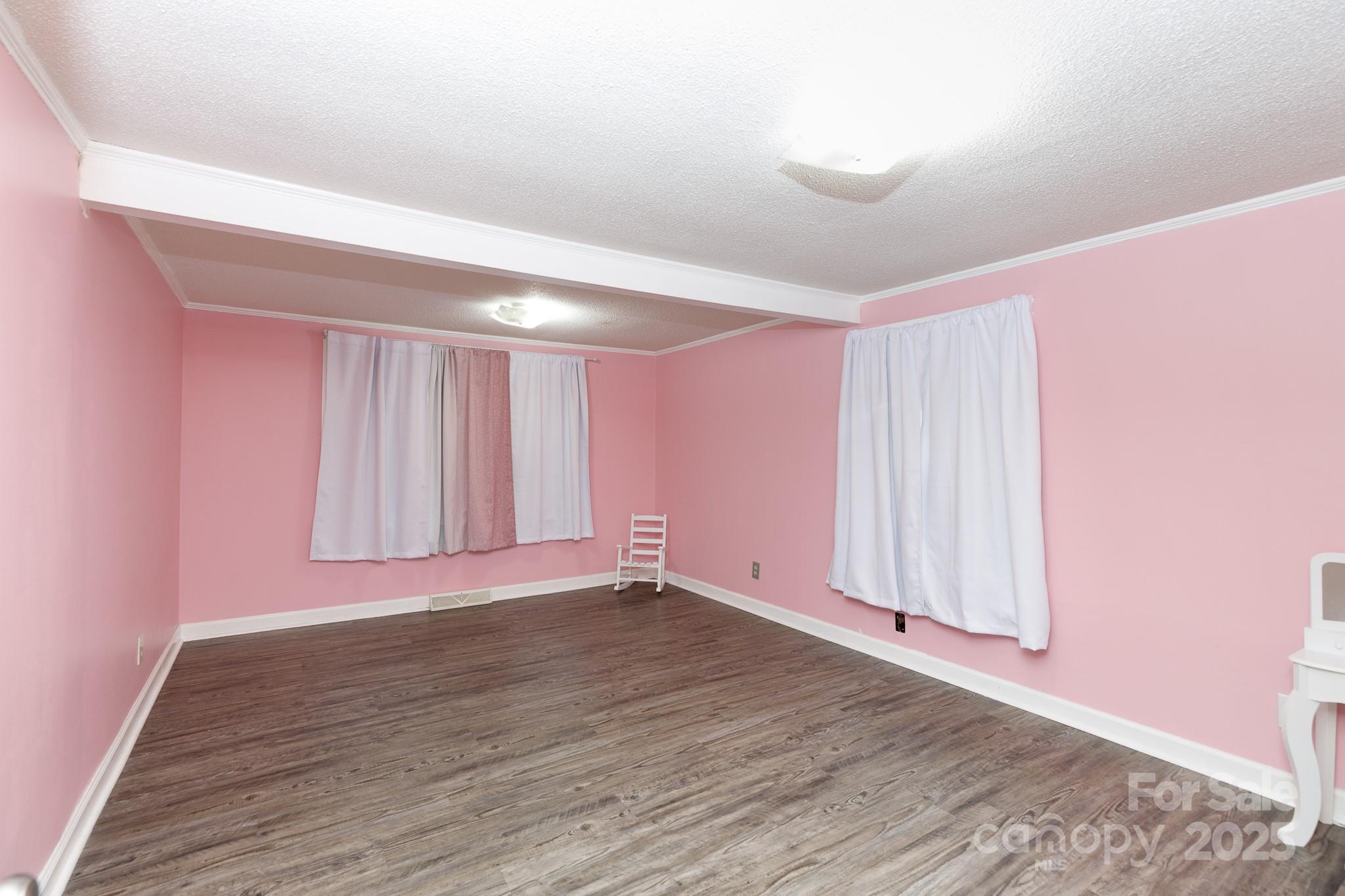 3393 Mt Holly Road Edgemoor, SC 29712 - Photo 12 of 21 a view of an empty room with wooden floor and a window