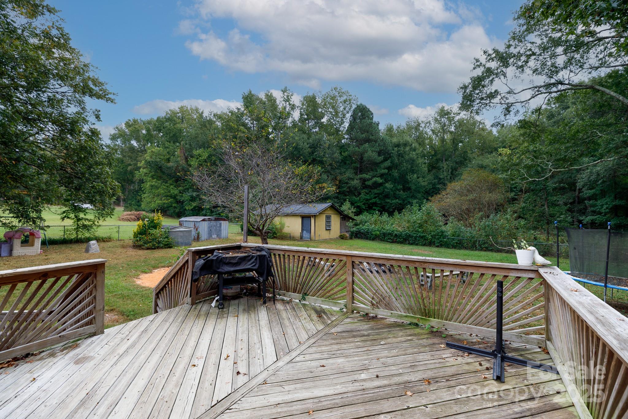 3393 Mt Holly Road Edgemoor, SC 29712 - Photo 18 of 21 a view of a wooden deck with furniture
