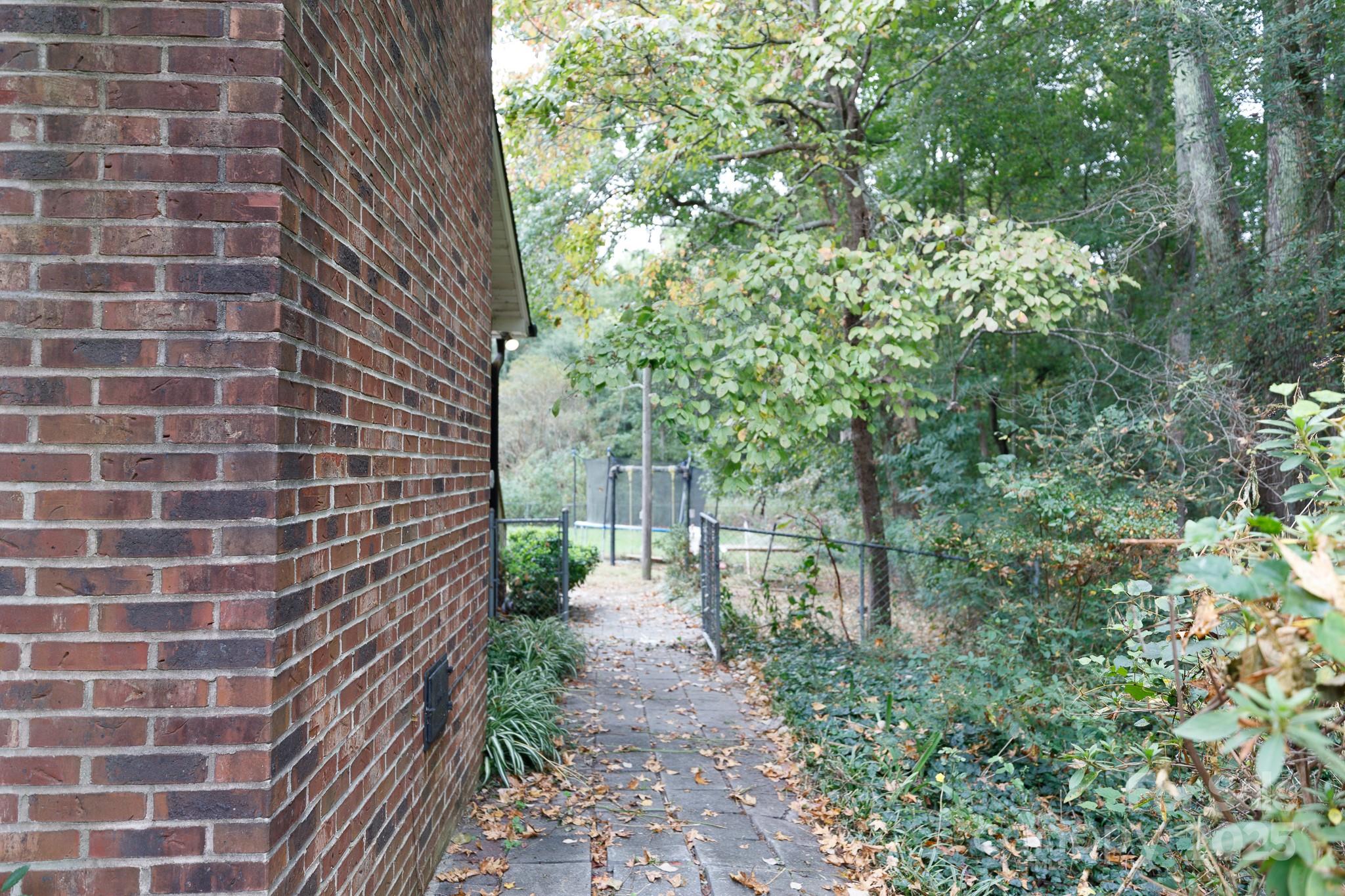 3393 Mt Holly Road Edgemoor, SC 29712 - Photo 20 of 21 a pathway of a house with a yard