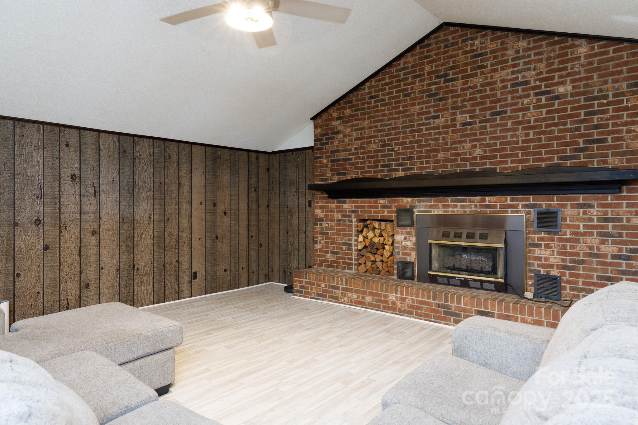 3393 Mt Holly Road Edgemoor, SC 29712 - Photo 5 of 21 a bedroom with a bed and a fireplace