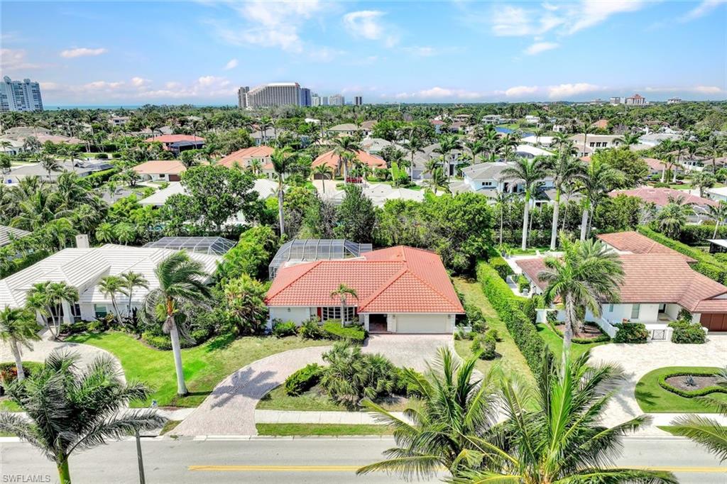 529 Neapolitan Way Naples, FL 34103 - Photo 14 of 18 an aerial view of residential houses with outdoor space and street view