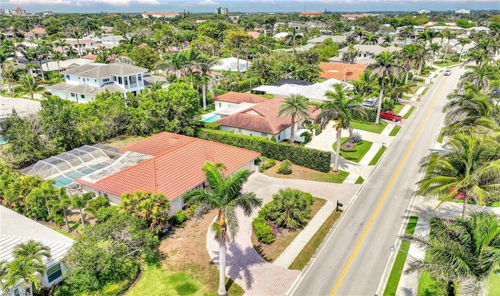 529 Neapolitan Way Naples, FL 34103 - Photo 15 of 18 view of outdoor space with garden