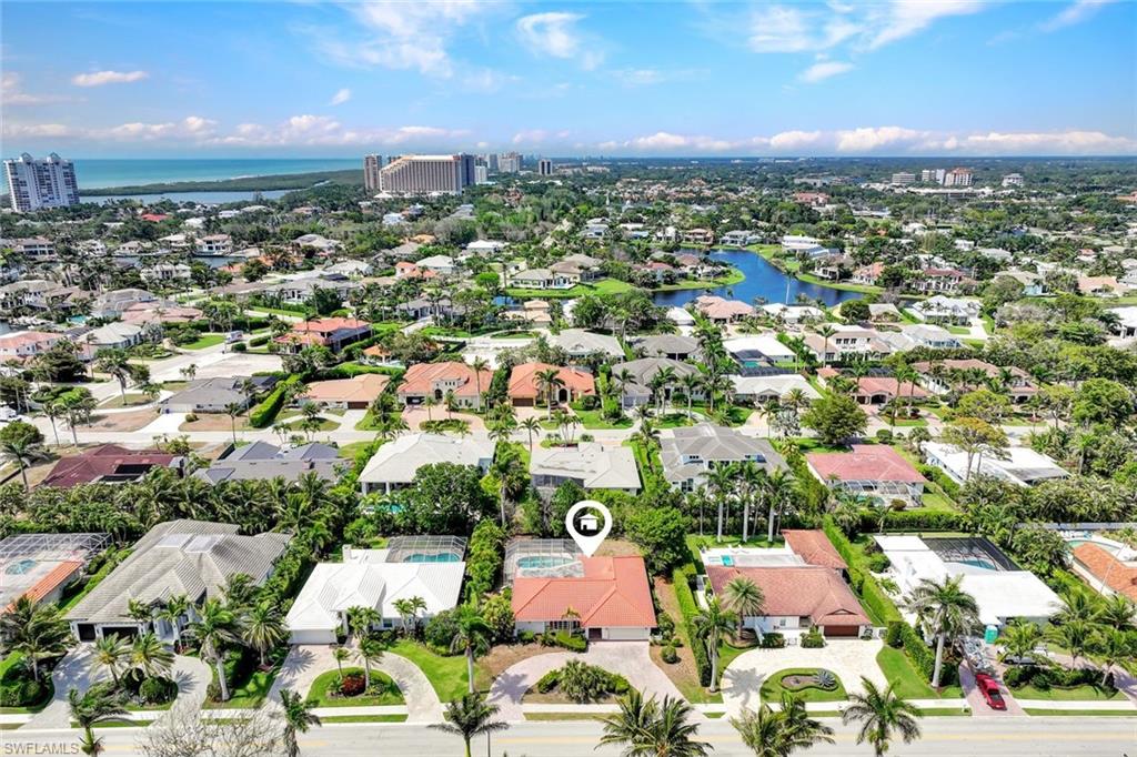 529 Neapolitan Way Naples, FL 34103 - Photo 18 of 18 an aerial view of residential houses with city view