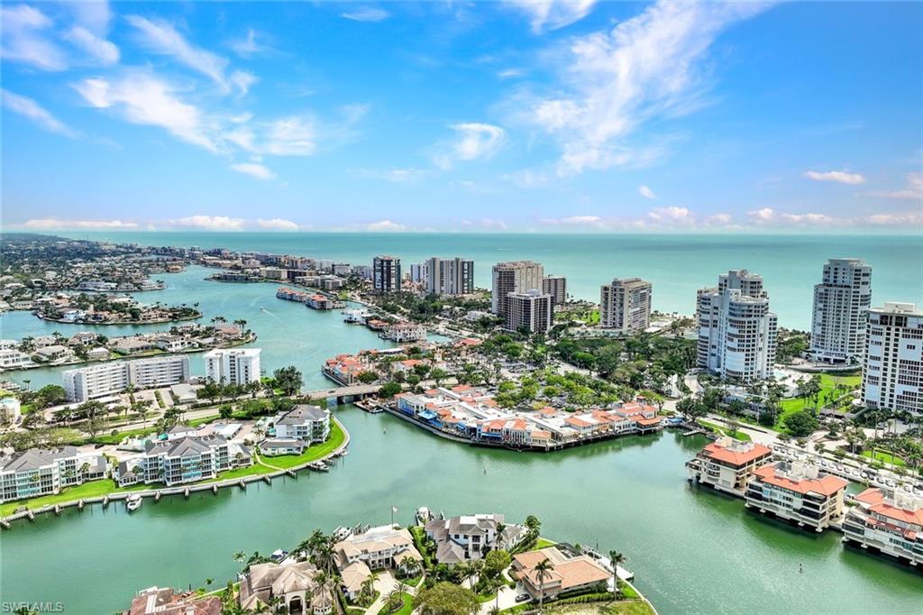 529 Neapolitan Way Naples, FL 34103 - Photo 10 of 18 an aerial view of a city with a lake view