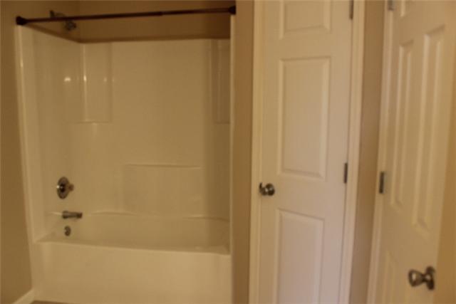 5773 Youngville Road Springfield, TN 37172 - Photo 12 of 19 a bathroom with a shower and a bath tub