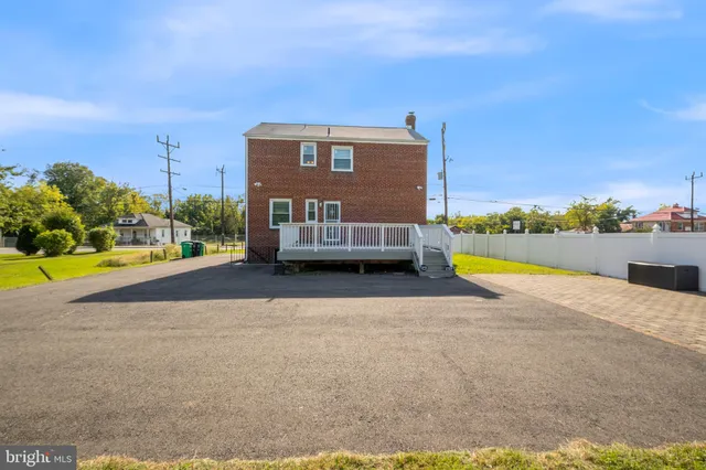 a view of a swimming pool with an outdoor space and seating area