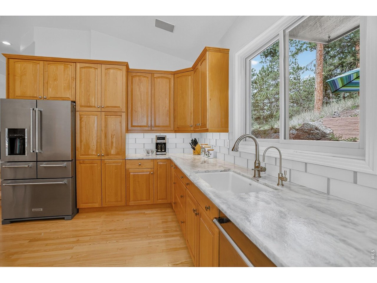65 Betasso Road Boulder, CO 80302 - Photo 5 of 38 a kitchen with stainless steel appliances granite countertop a sink and a refrigerator