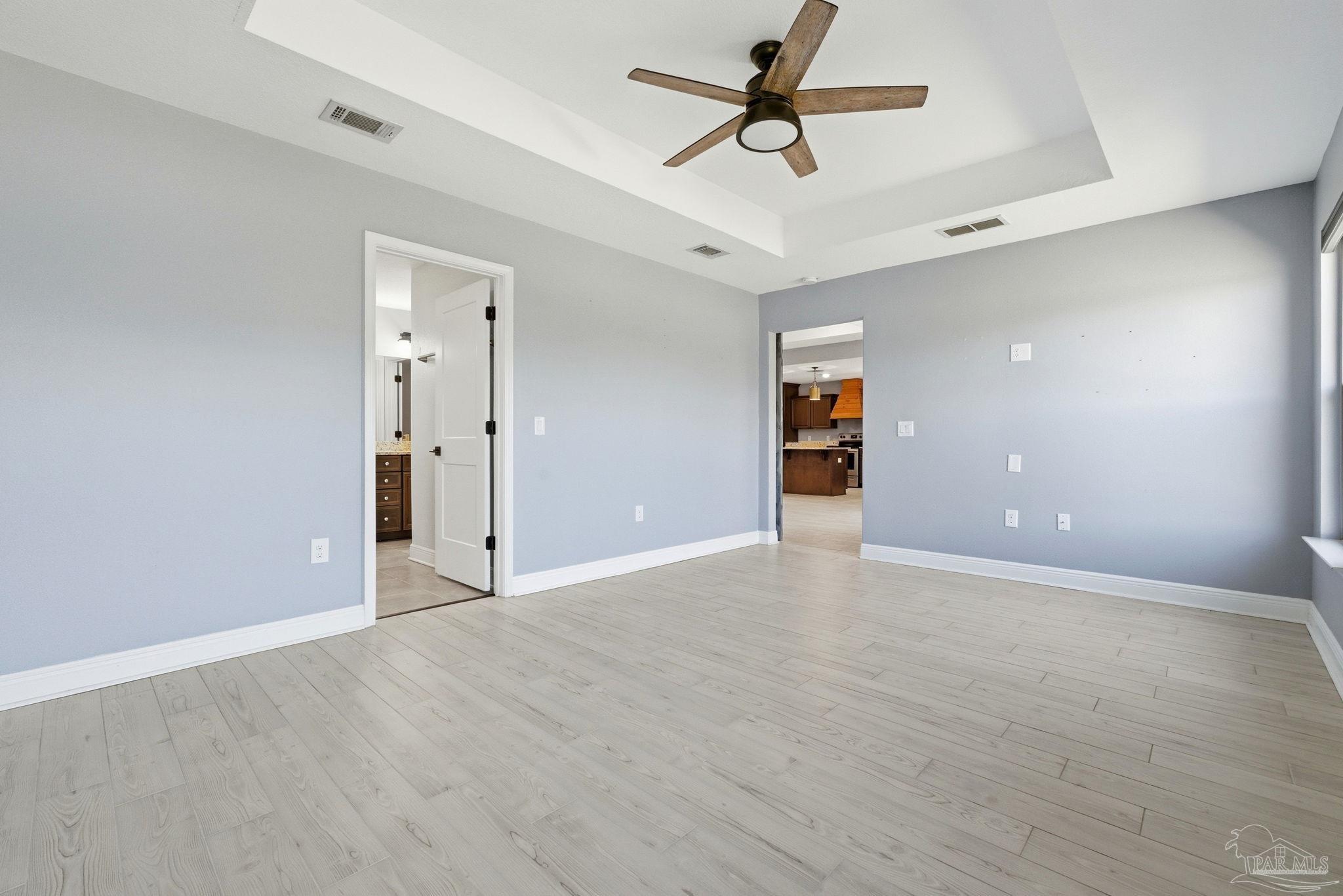 2033 Chavers Road Cantonment, FL 32533 - Photo 14 of 42 wooden floor in an empty room with a window