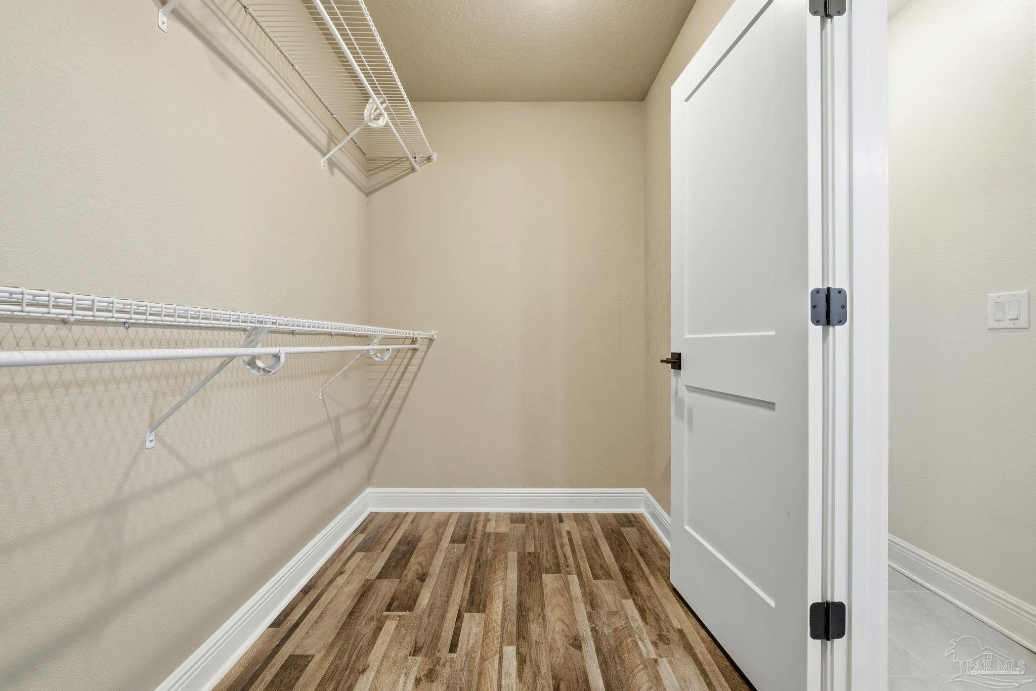 2033 Chavers Road Cantonment, FL 32533 - Photo 18 of 42 a view of a room with wooden floor