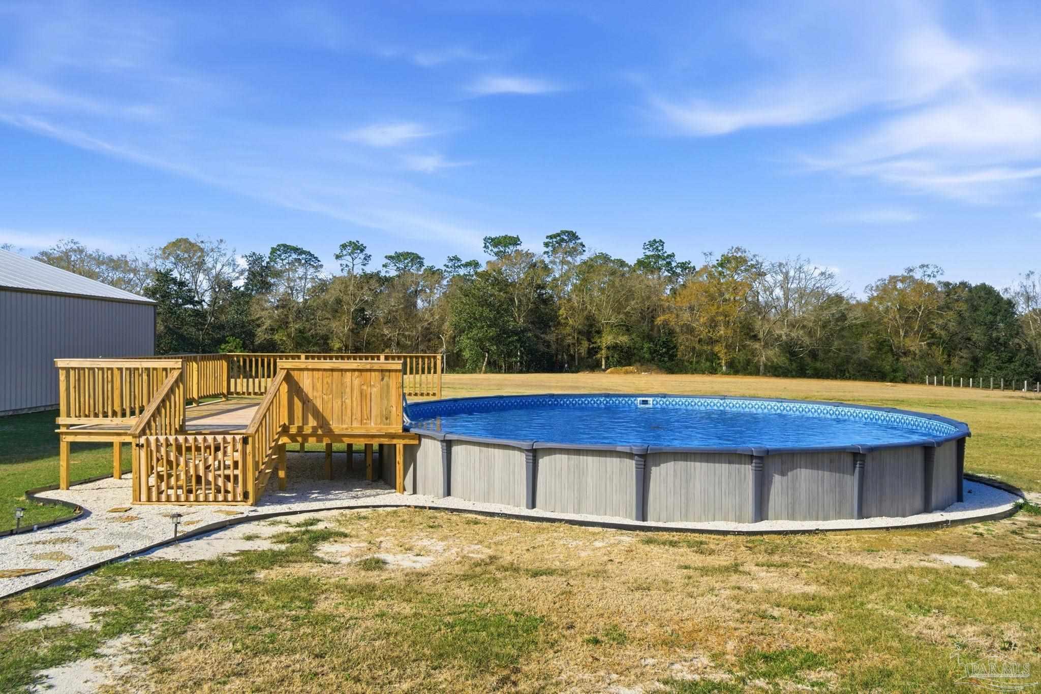 2033 Chavers Road Cantonment, FL 32533 - Photo 32 of 42 a view of swimming pool with a yard