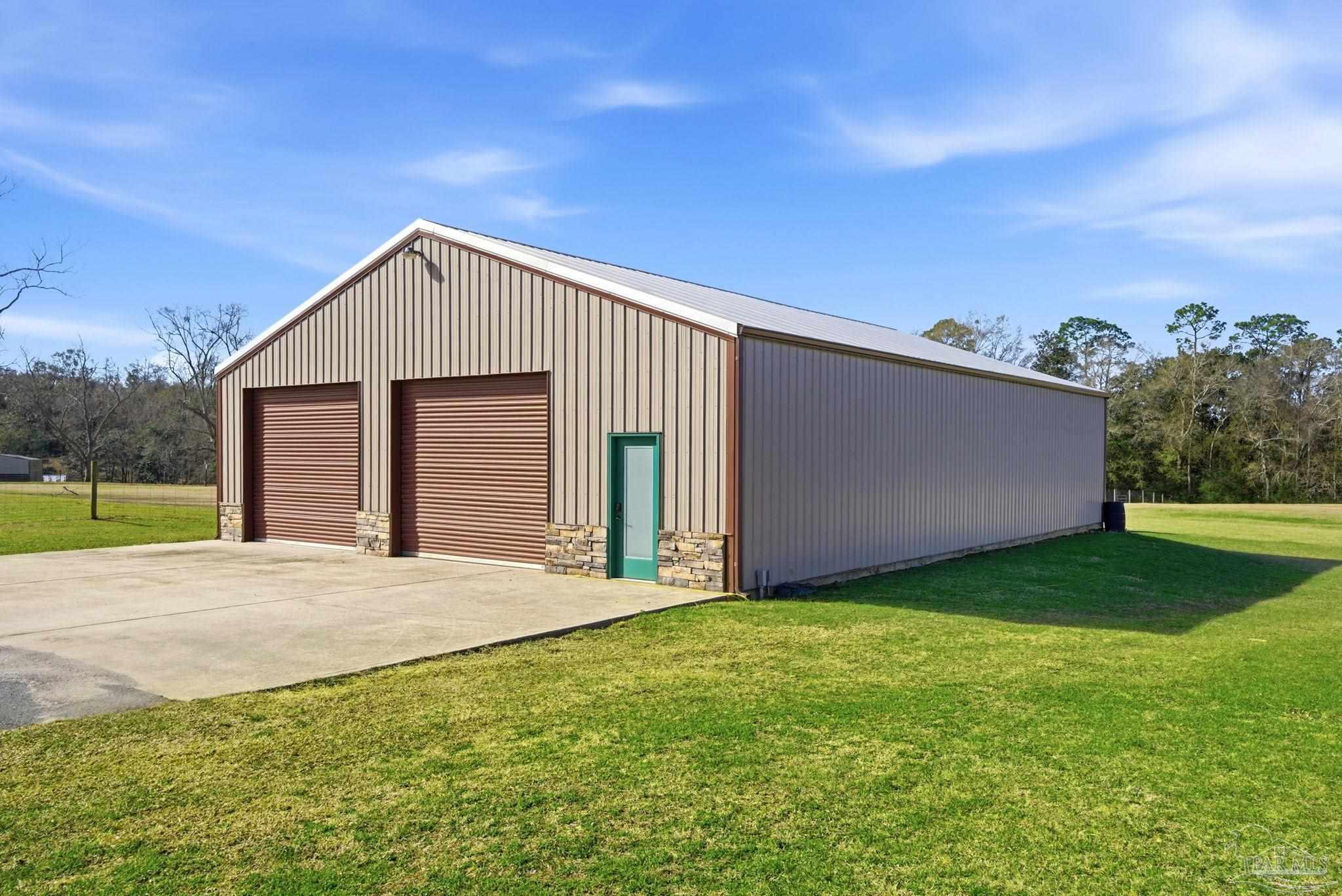 2033 Chavers Road Cantonment, FL 32533 - Photo 35 of 42 a view of a house with backyard and garden