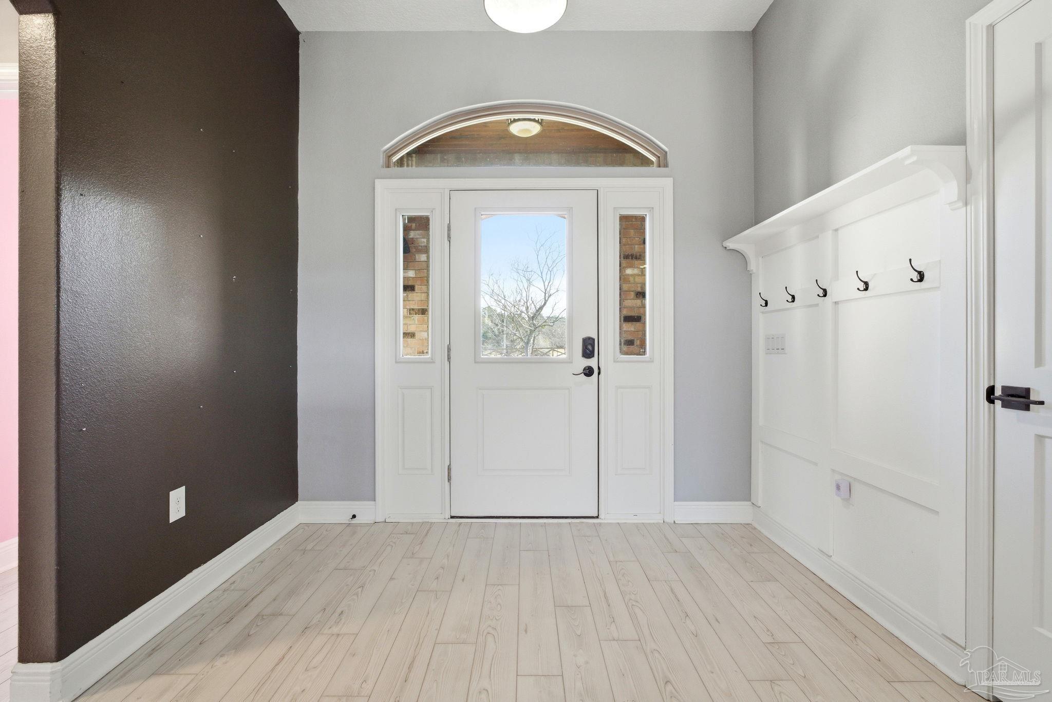 2033 Chavers Road Cantonment, FL 32533 - Photo 4 of 42 wooden floor and white doors