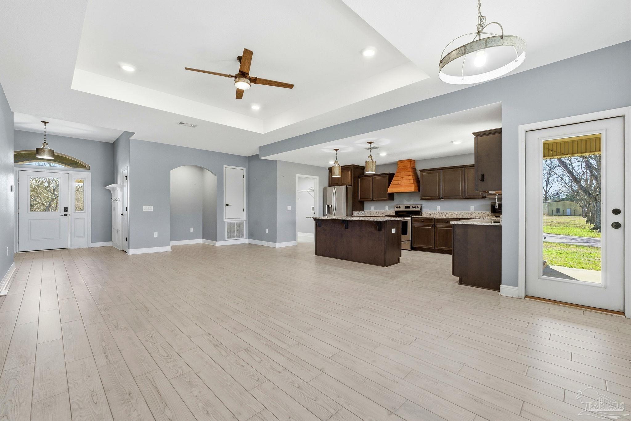 2033 Chavers Road Cantonment, FL 32533 - Photo 8 of 42 a view of a kitchen with furniture and a ceiling fan