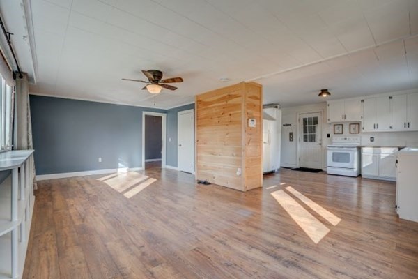 56 Old Belchertown Road Ware, MA 01082 - Photo 7 of 25 a view of empty room with wooden floor and kitchen view