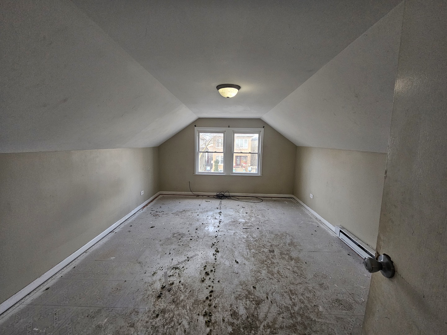 2715 North Monitor Avenue Chicago, IL 60639 - Photo 16 of 23 an empty room that has a window in it