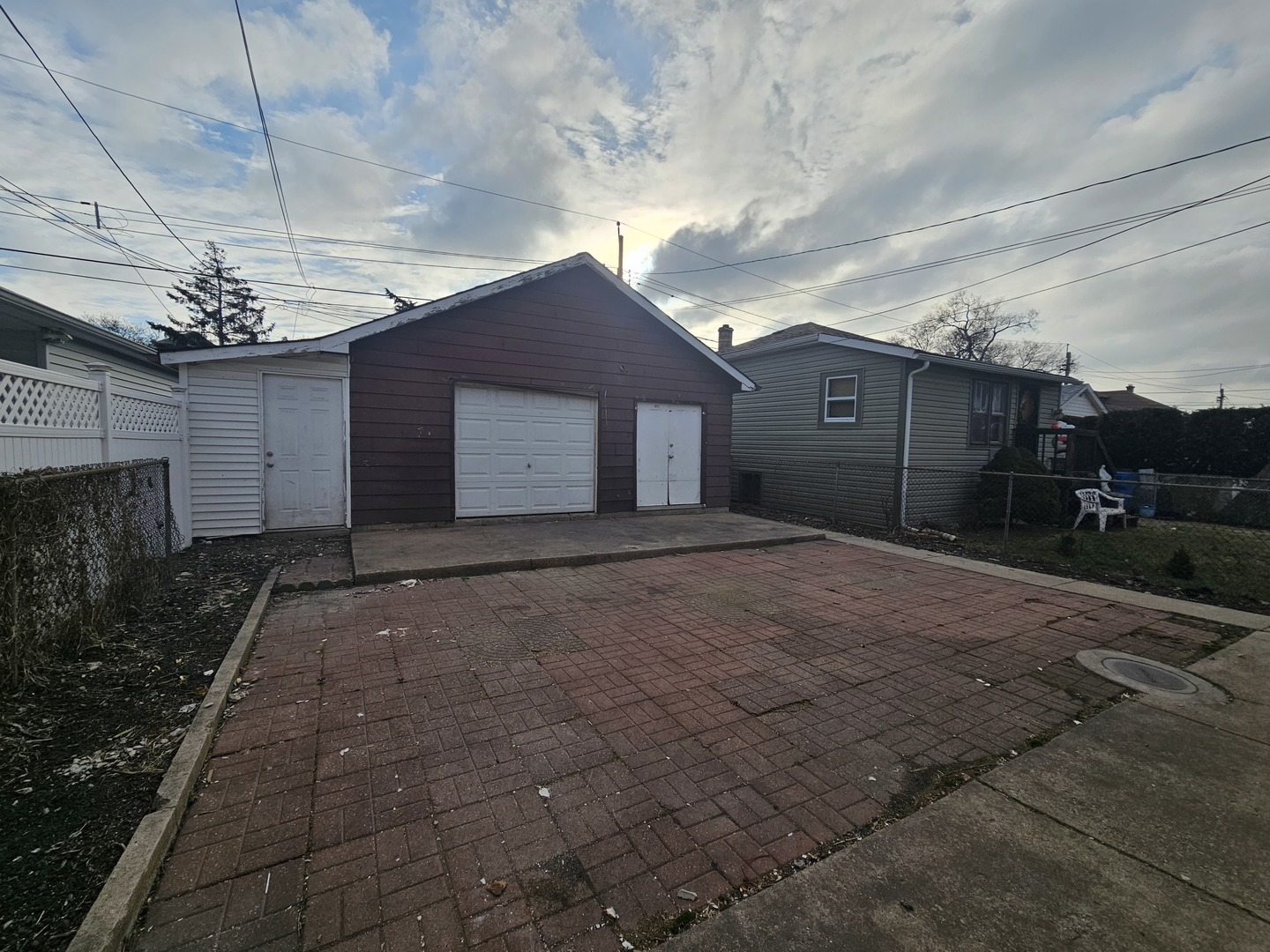 2715 North Monitor Avenue Chicago, IL 60639 - Photo 22 of 23 a view of a house next to a yard