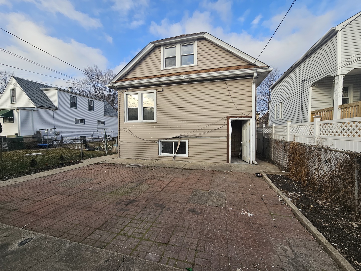2715 North Monitor Avenue Chicago, IL 60639 - Photo 23 of 23 a front view of a house with a yard and garage