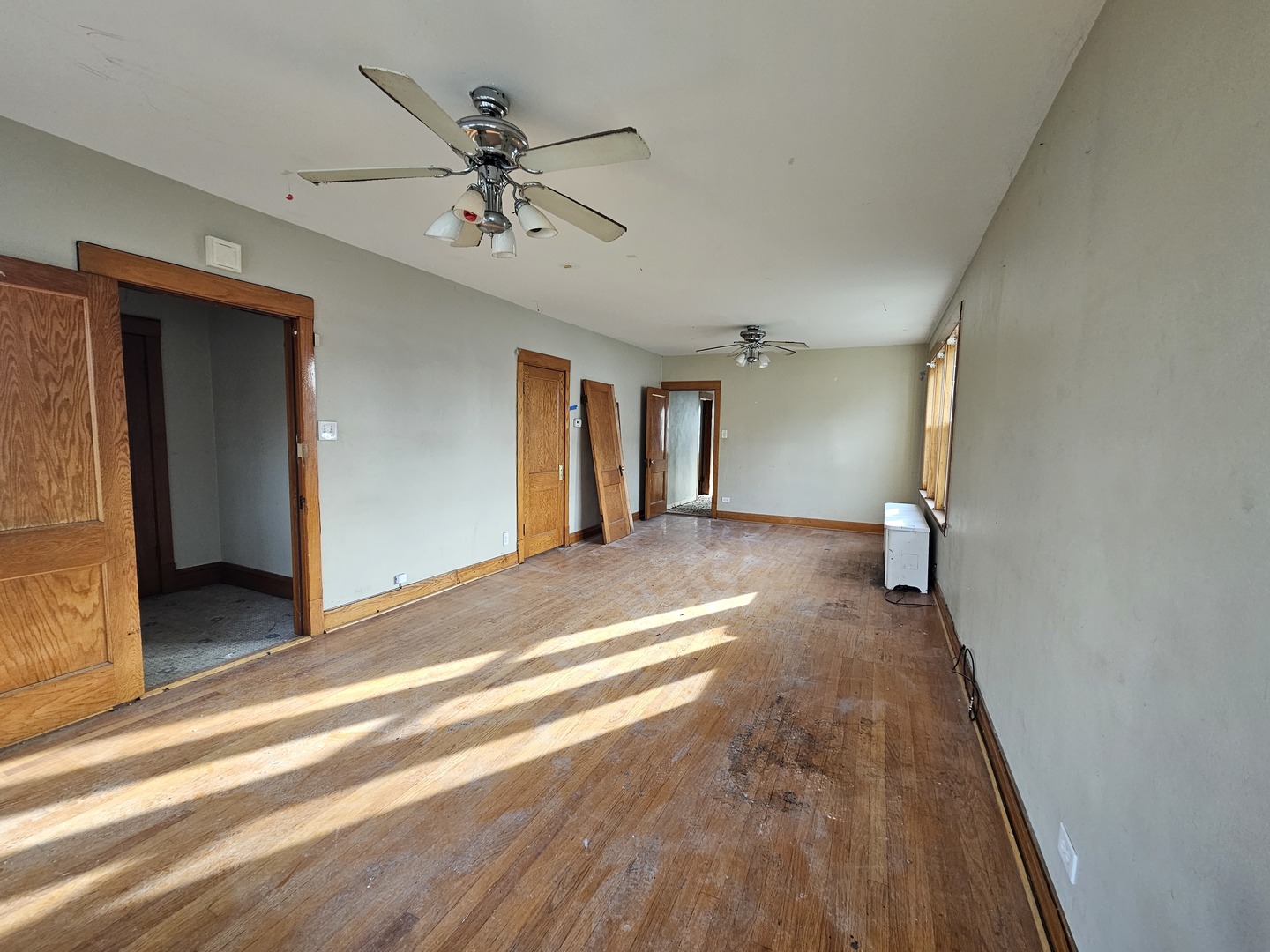 2715 North Monitor Avenue Chicago, IL 60639 - Photo 4 of 23 a view of a livingroom with a ceiling fan and wooden floor