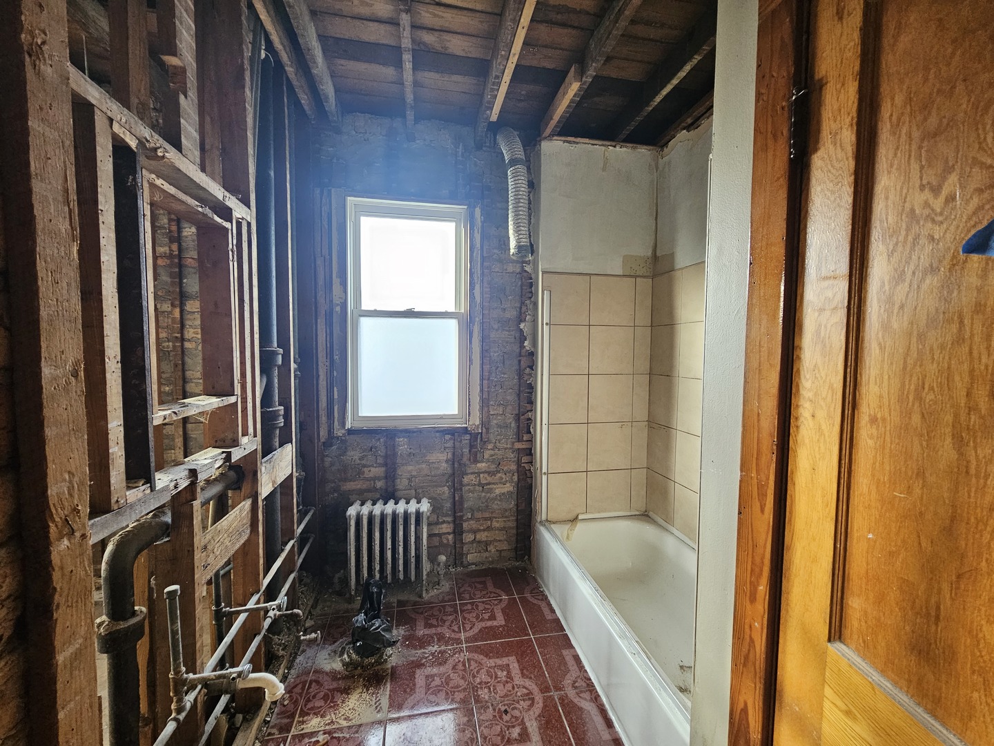 2715 North Monitor Avenue Chicago, IL 60639 - Photo 8 of 23 a bathroom with a bathtub and a shower