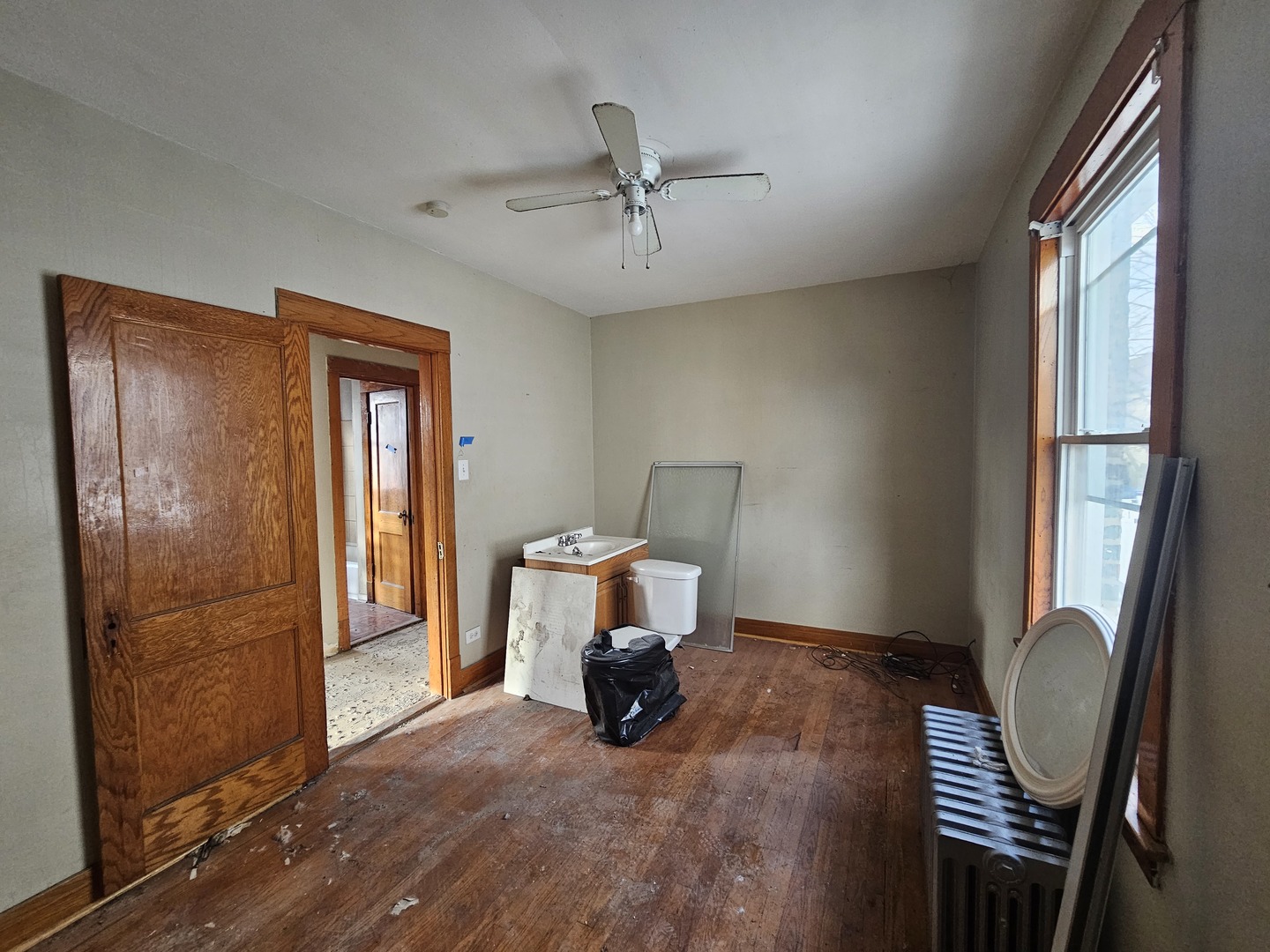2715 North Monitor Avenue Chicago, IL 60639 - Photo 9 of 23 a view of room with window and wooden floor