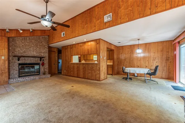 a view of a livingroom with furniture and a fireplace