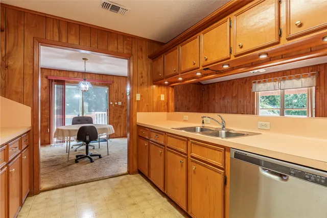 a bathroom with a sink and a window