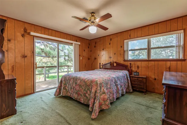 a bed sitting in a room next to a window