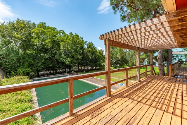 a view of a balcony with wooden floor
