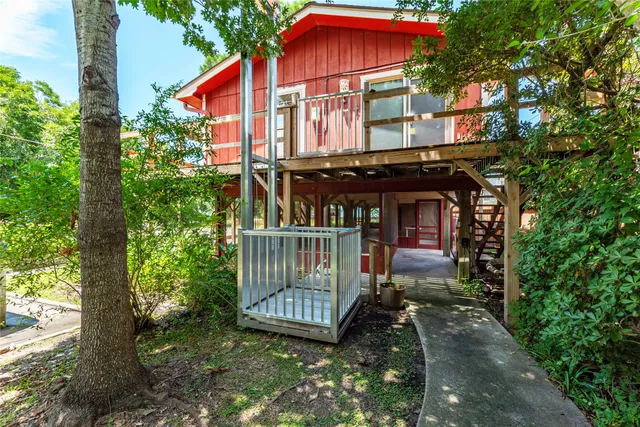 a view of a house with a yard and sitting area