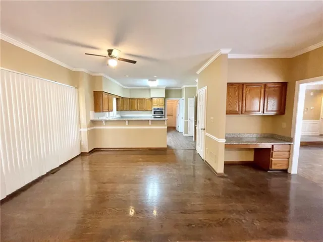 a view of kitchen with cabinets and wooden floor