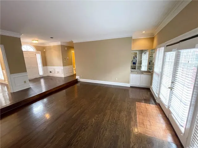 a view of a living room with a large window