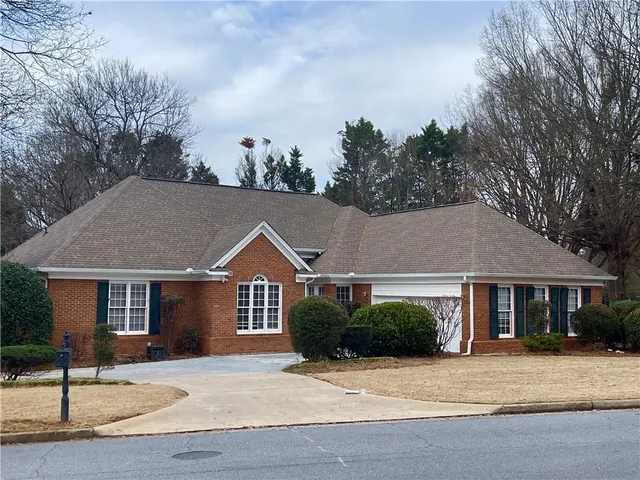a view of house with yard