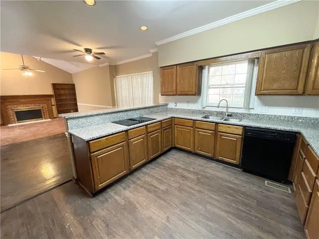 a kitchen with sink and cabinets