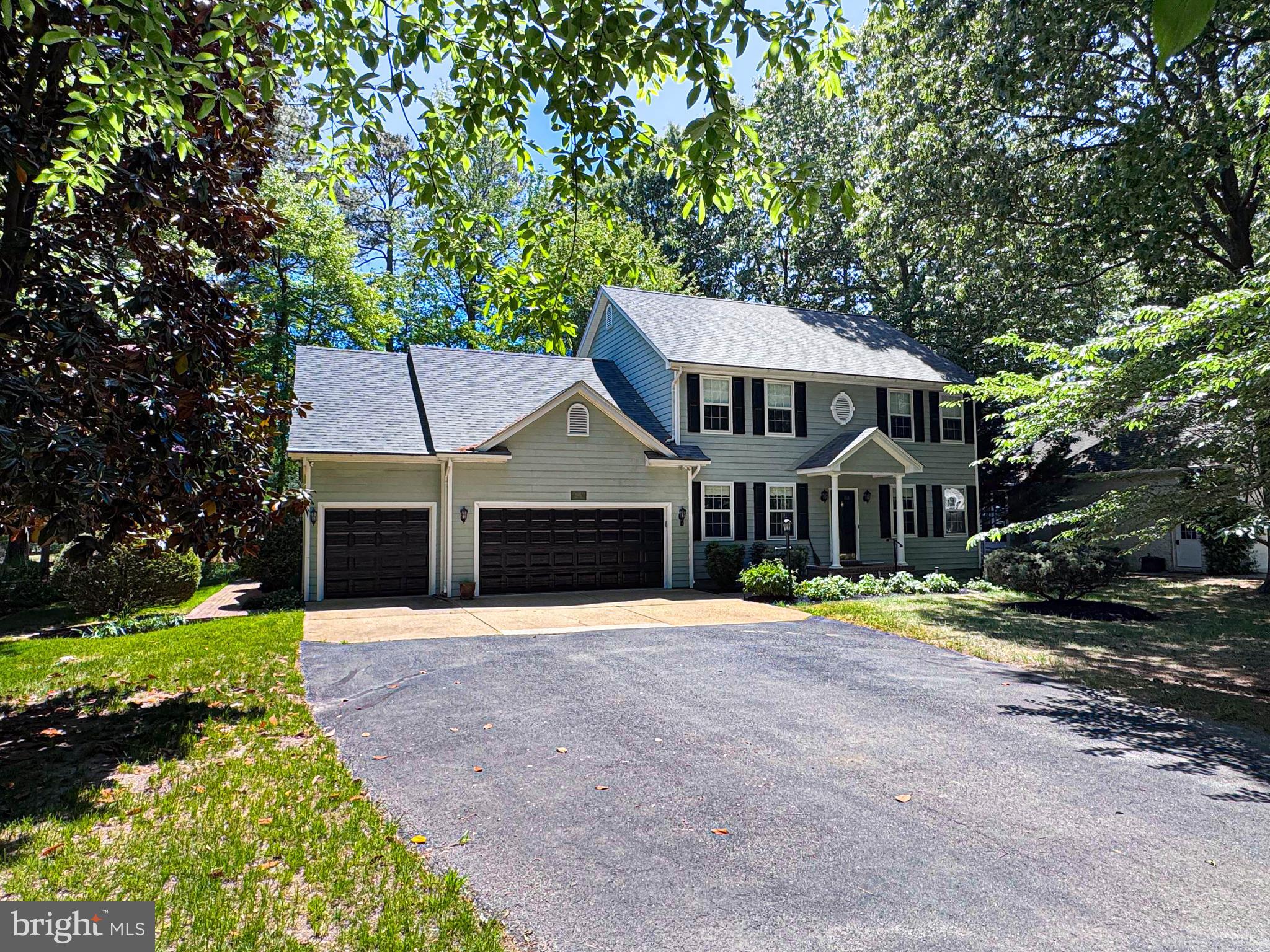 11325 Ingels Court Swan Point, MD 20645 - Photo 11 of 118 a front view of a house with a garden