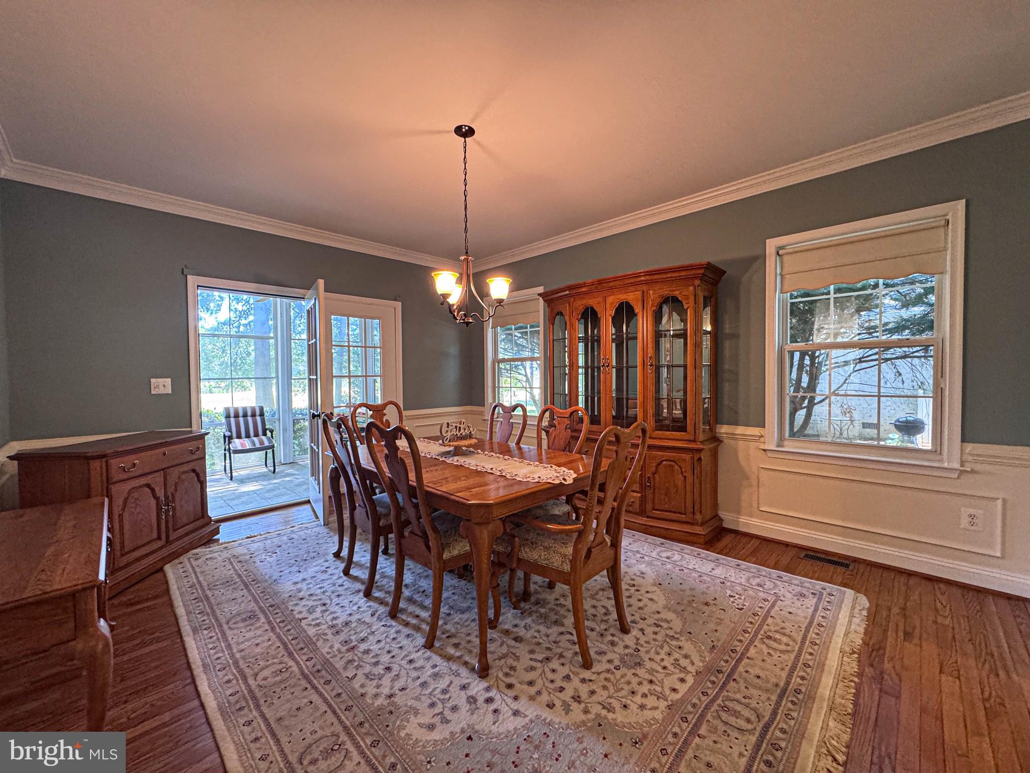 11325 Ingels Court Swan Point, MD 20645 - Photo 14 of 118 a view of a dining room with furniture window and wooden floor