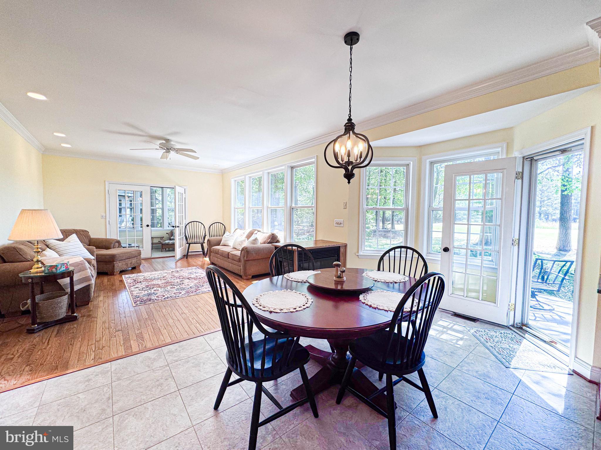 11325 Ingels Court Swan Point, MD 20645 - Photo 30 of 118 a view of a dining room with furniture window and wooden floor