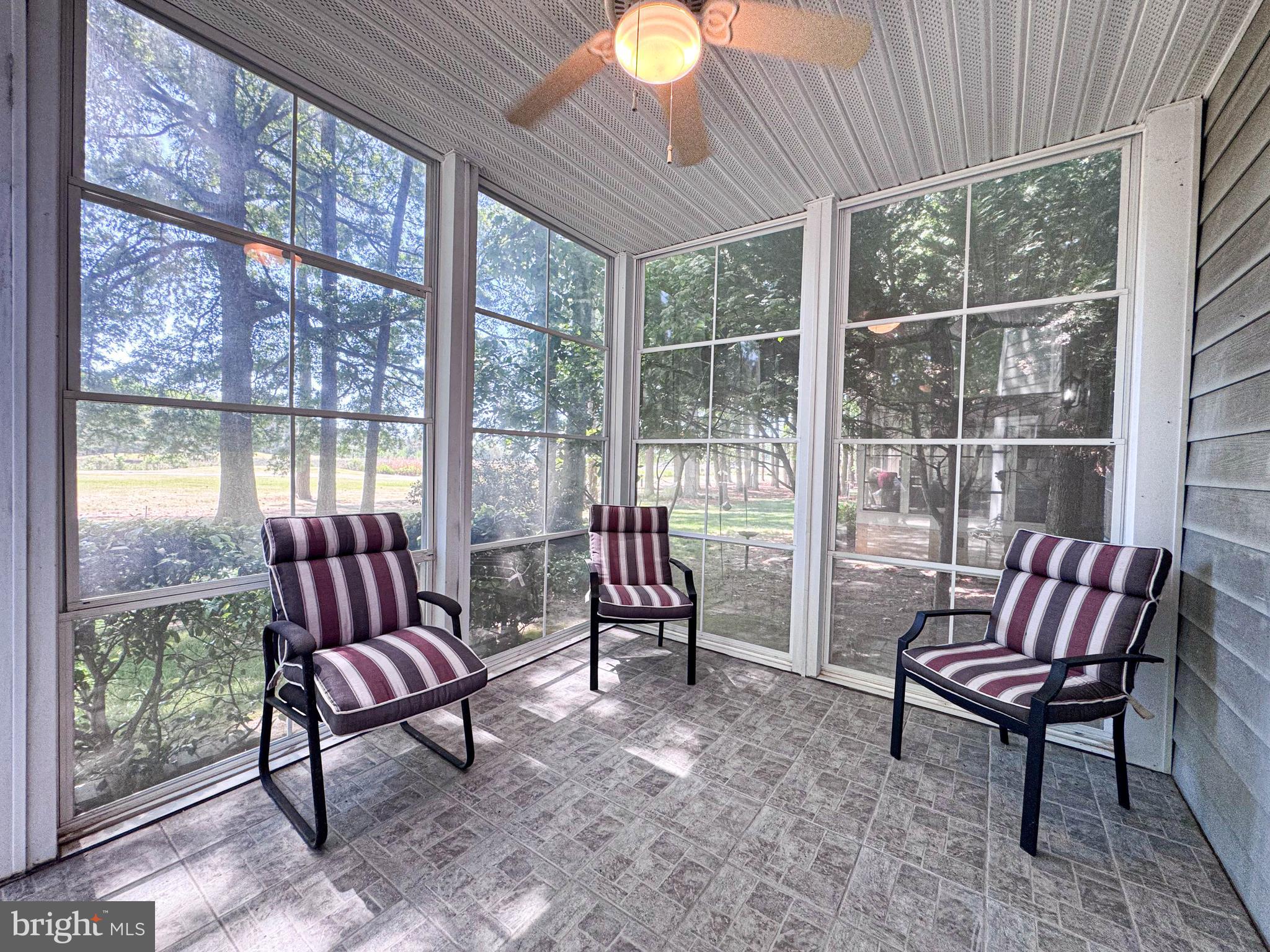 11325 Ingels Court Swan Point, MD 20645 - Photo 61 of 118 a living room with furniture and a floor to ceiling window