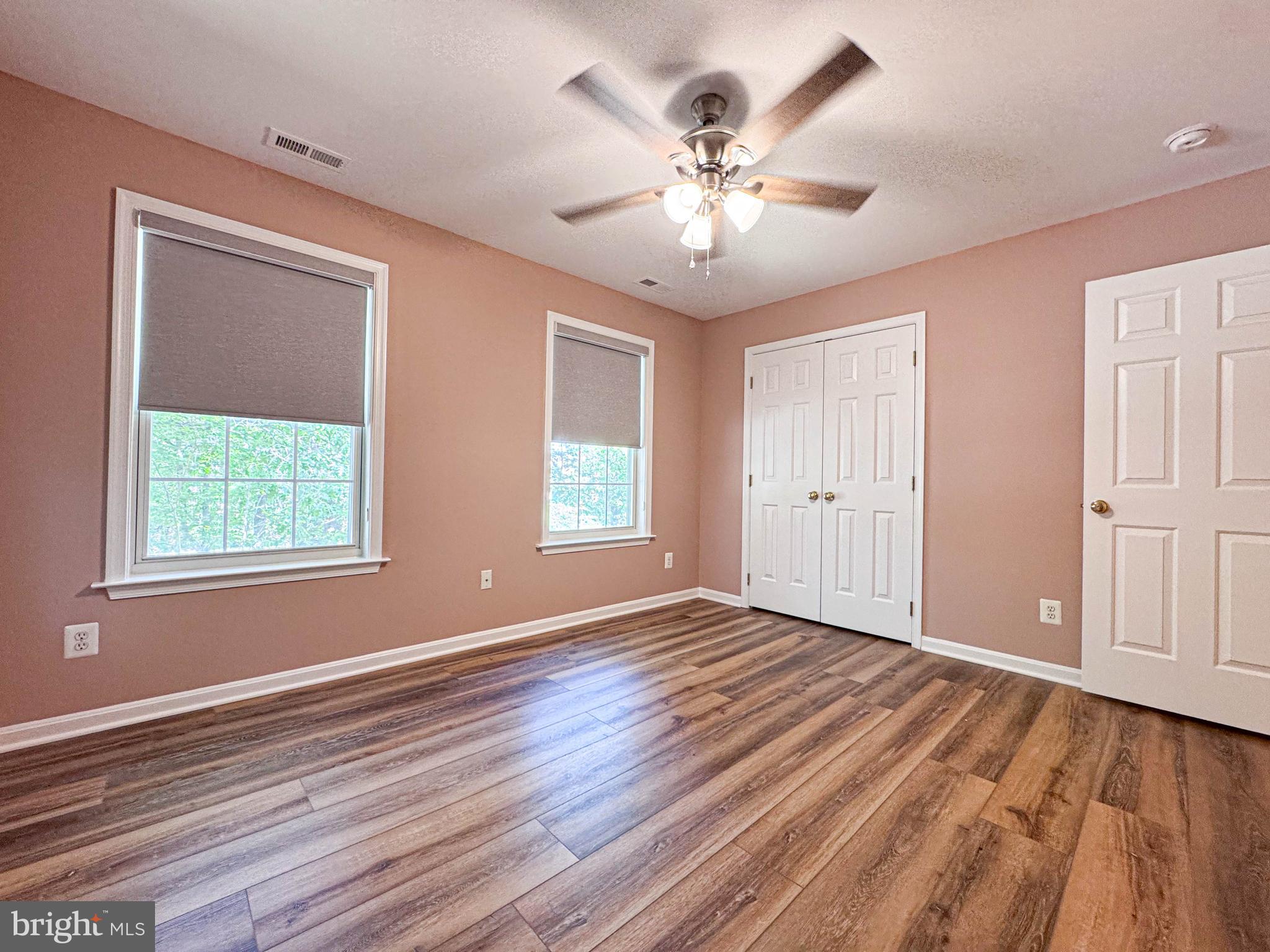 11325 Ingels Court Swan Point, MD 20645 - Photo 71 of 118 a view of an empty room with wooden floor and a window