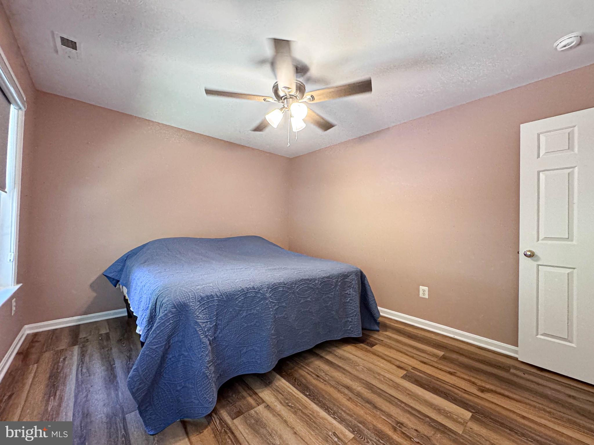 11325 Ingels Court Swan Point, MD 20645 - Photo 75 of 118 a bedroom with a bed and a ceiling fan