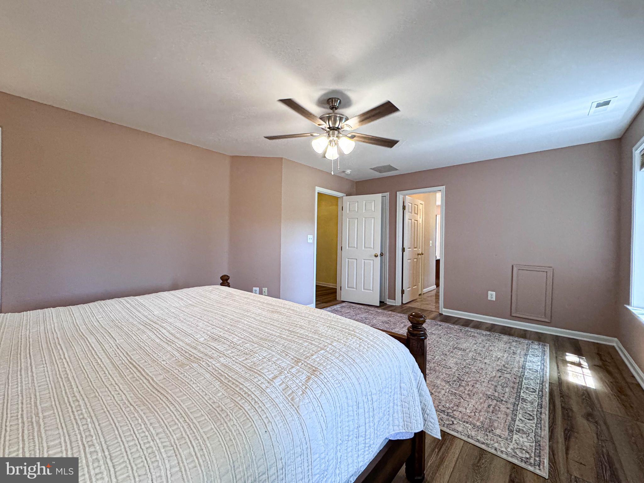 11325 Ingels Court Swan Point, MD 20645 - Photo 79 of 118 a bedroom with a bed and a ceiling fan