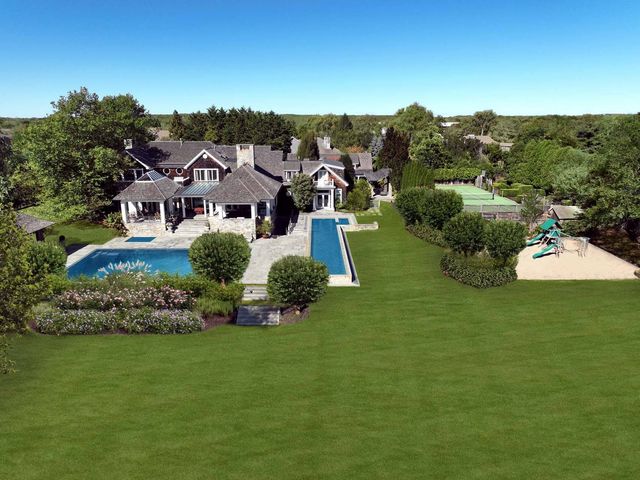 an aerial view of a house with a garden