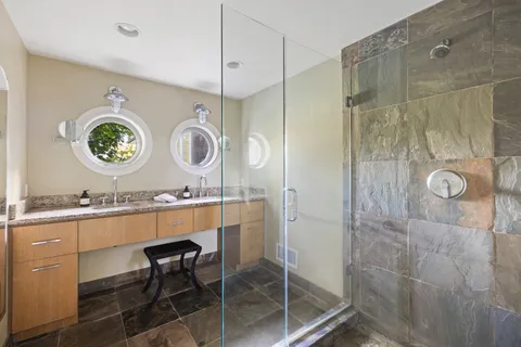 a room with a wooden floor and a chandelier