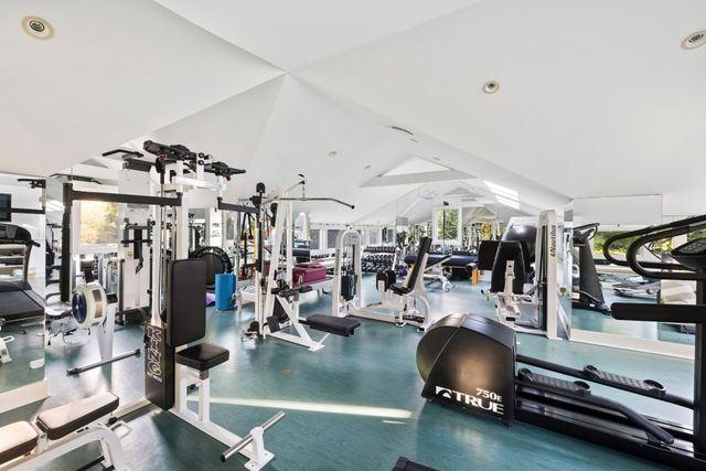 an aerial view of residential houses with yard