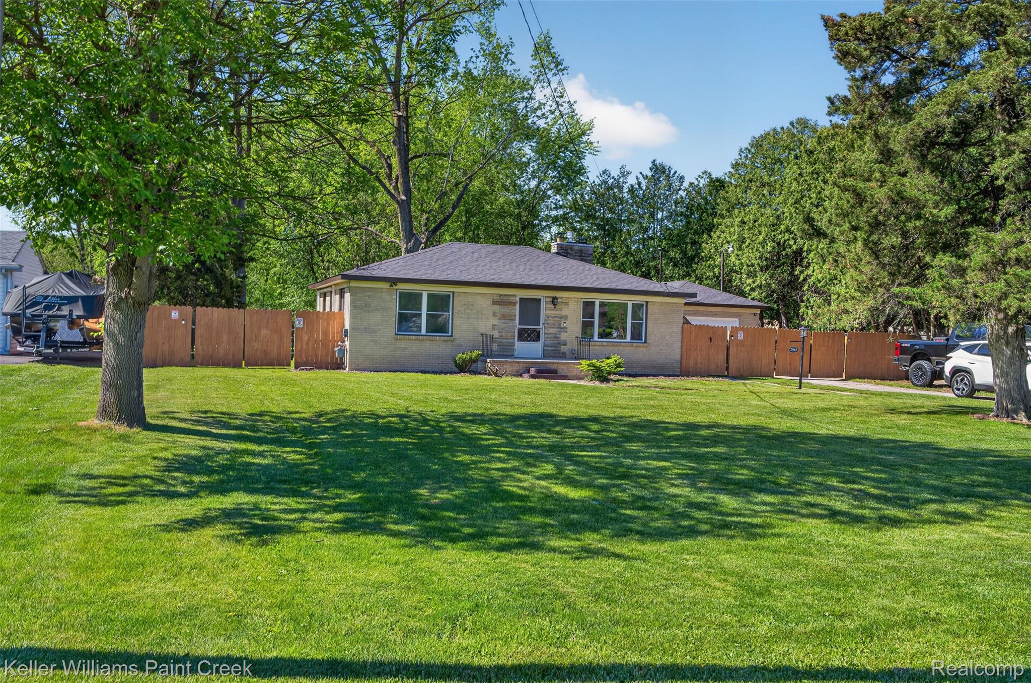 2942 Tatham Road Saginaw, MI 48601 - Photo 42 of 59 View of front of home with a chimney and a gate