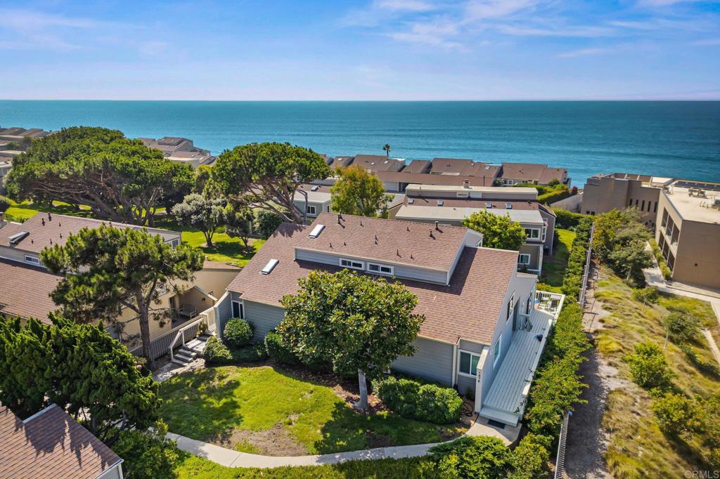 an aerial view of a house with a lake view