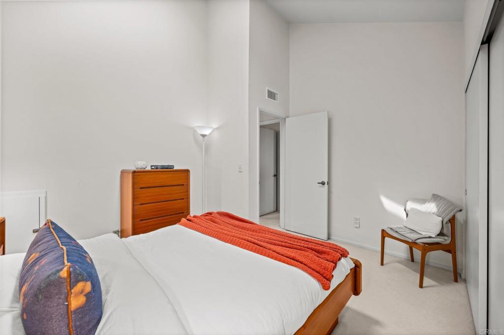 1876 Haymarket Road Encinitas, CA 92024 - Photo 18 of 43 a bedroom with a bed and dresser