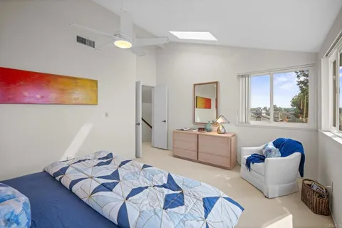 a bedroom with furniture and a window