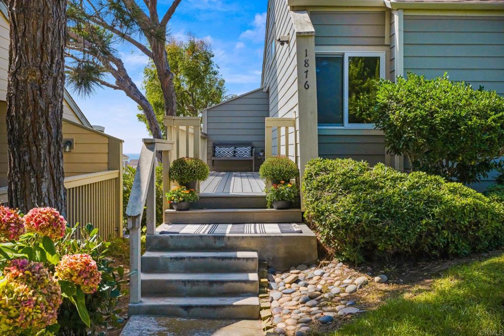 1876 Haymarket Road Encinitas, CA 92024 - Photo 3 of 43 a front view of a house with plants and garden
