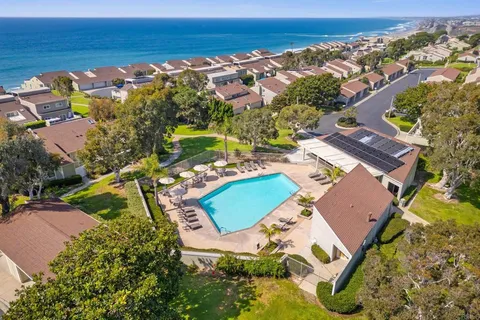 an aerial view of a house with a ocean view