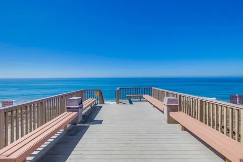 a view of a balcony with ocean view